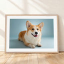 Framed mockup of The Soft Portrait — Mist Blue by YOUNI.ONE. A bespoke horizontal dog portrait set against a mist blue studio backdrop, finished with a white gallery border and classic wood frame.