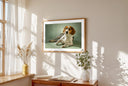 Framed lifestyle mockup of The Soft Gallery — Sage by YOUNI.ONE. A bespoke horizontal dog portrait set against a soft Sage studio backdrop, displayed as gallery-style wall art in a calm modern interior.