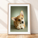 Framed mockup of The Soft Portrait — Sage by YOUNI.ONE. A bespoke vertical dog portrait set against a soft Sage studio backdrop, finished with a white gallery border and classic wood frame.