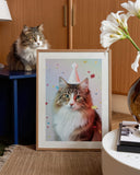 "The Gallery Wall" by YOUNI.ONE. A sophisticated home styling mockup featuring a bespoke long-haired cat portrait in a light wood frame, elegantly resting on a textured rug. The museum-grade pet art highlights a soft pastel background and celebratory birthday theme, curated to elevate warm living spaces.